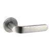 brass lever handle on round rose with escutcheon for doors